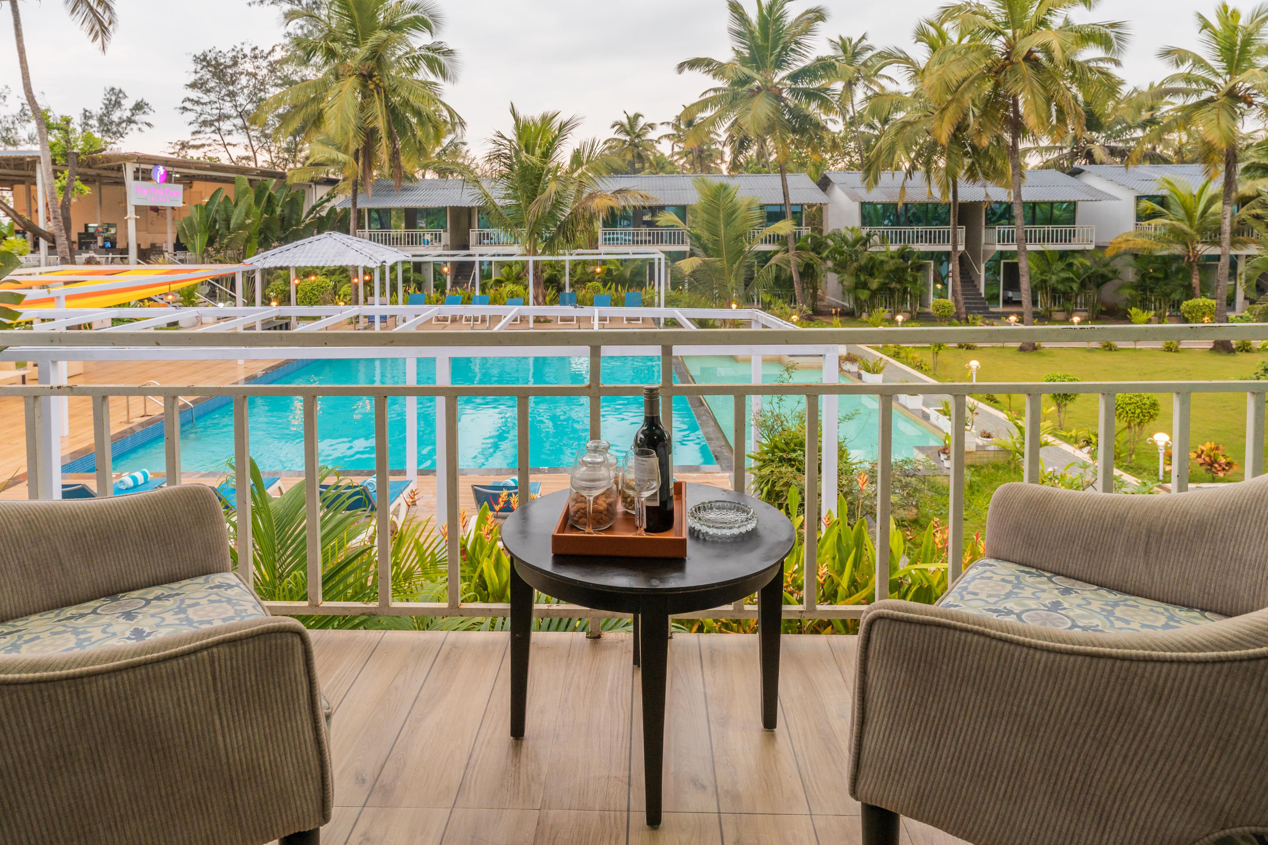 Balcony with pool view at Morjim Goa